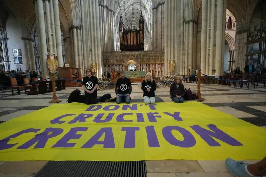 climate activists detained for climbing bath abbey tower