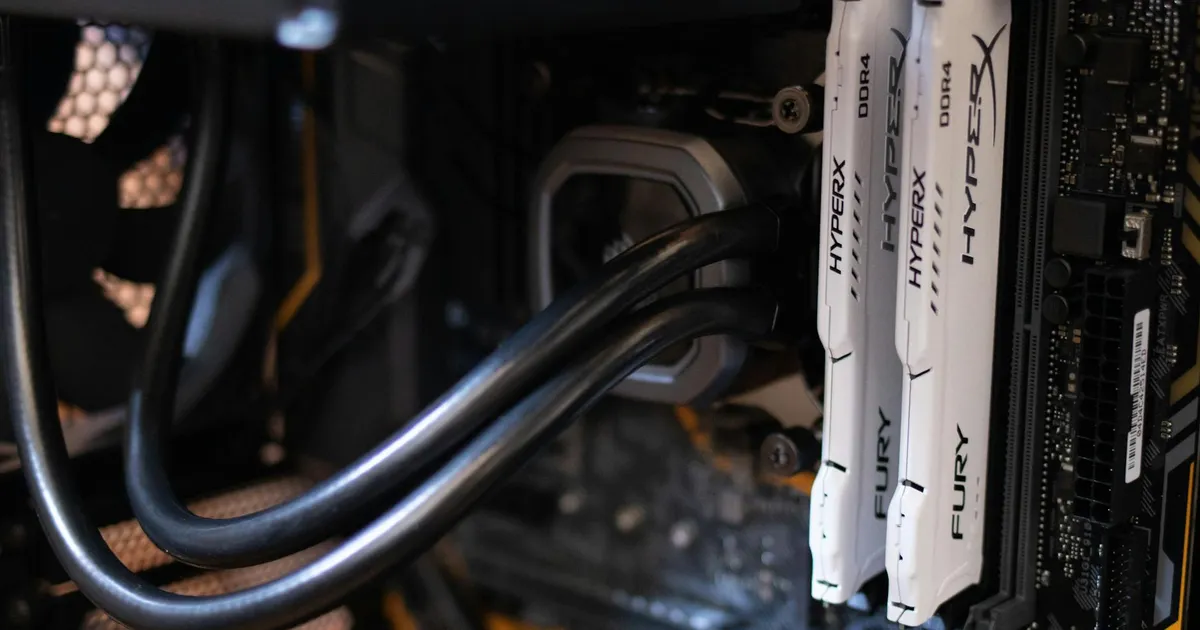 Detailed close-up of computer components including RAM and cables inside a server or high-performance PC.